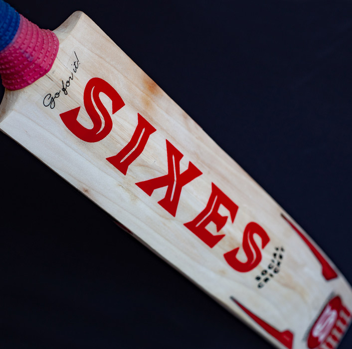 Sixes Social Cricket — Face Sticker Detail — "Go for it!" Script and Vertical SIXES Lettering